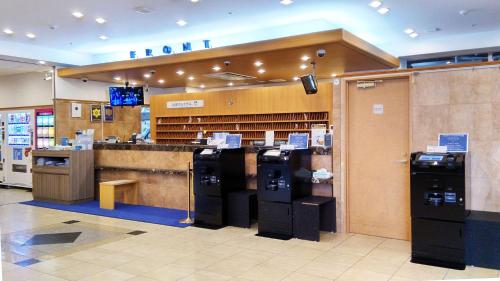 a store with a cashier and a bar in a mall at Toyoko Inn Tokyo Shinjuku Kabukicho in Tokyo