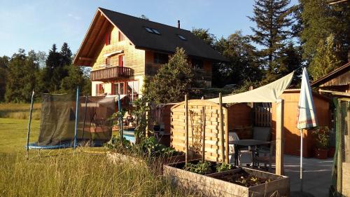 a house with a garden in front of it at Neumühleweg 19 in Lauperswil