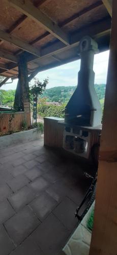 a view of an outdoor kitchen with a stove at Gîte "Le Pacifique" in Esneux
