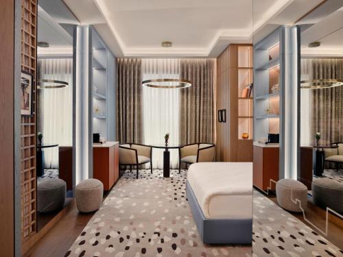 a hotel room with a bed and a desk at Ramada Plaza By Wyndham Istanbul City Center in Istanbul