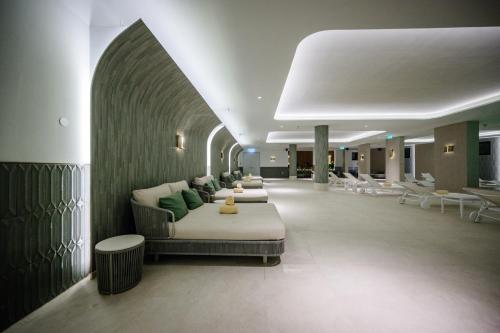 a hospital lobby with couches and chairs in a hallway at Amadria Park Grand Hotel 4 Opatijska Cvijeta in Opatija