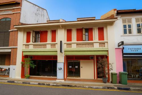 a building on the corner of a street at Wink at Perak Road in Singapore