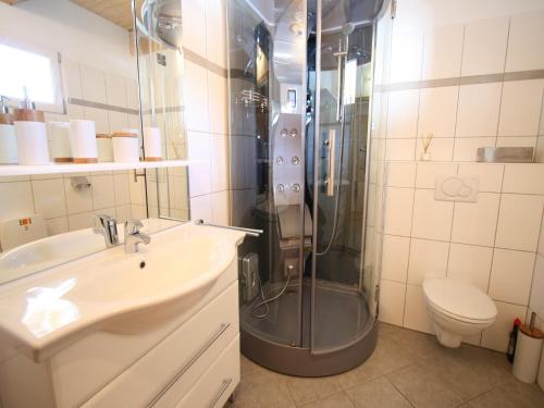 a bathroom with a shower and a sink and a toilet at Chalet in Hohentauern near Ski Lift in Hohentauern