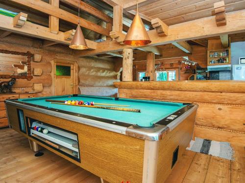 a game room with a pool table in a cabin at 8 person holiday home in Ebeltoft in Ebeltoft