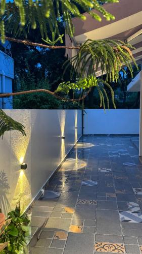 a patio with lights on the side of a building at Prantara in Dehradun