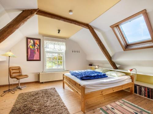 a bedroom with a bed and a window at Holiday home Het Zuidgoed with garden in Aartrijke