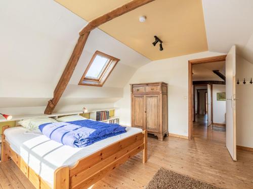 a bedroom with a bed in a attic at Holiday home Het Zuidgoed with garden in Aartrijke
