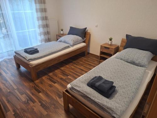 Ένα ή περισσότερα κρεβάτια σε δωμάτιο στο Ferienwohnung Sonja mit Terrasse