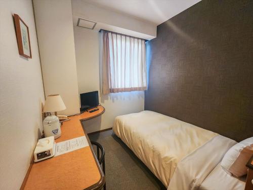 Ένα ή περισσότερα κρεβάτια σε δωμάτιο στο Hotel Kakegawa Hills
