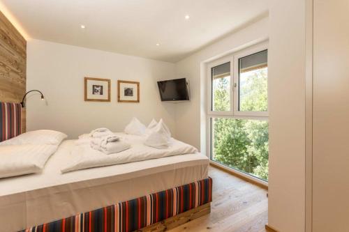 Cama o camas de una habitación en Almfrieden Hotel & Romantikchalet
