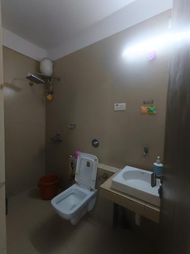 a bathroom with a toilet and a sink at Sky line villa, Lonavla in Lonavala