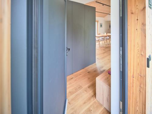 a room with a sliding door leading to a dining room at Chalet Hochsteiermark in Mariazell