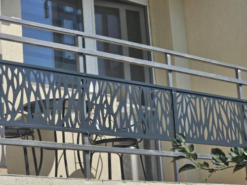 a blue metal railing on a balcony at SMB home PANORAMA in Oradea