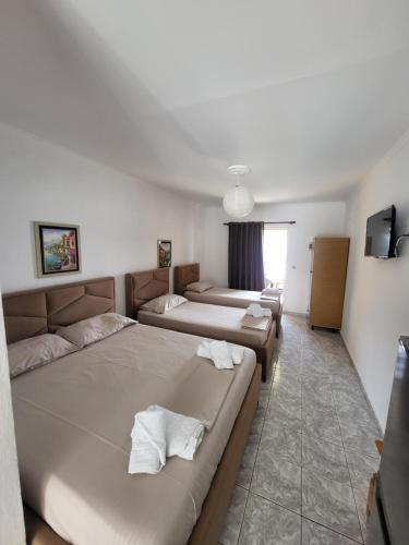 Ένα ή περισσότερα κρεβάτια σε δωμάτιο στο Melina rooms