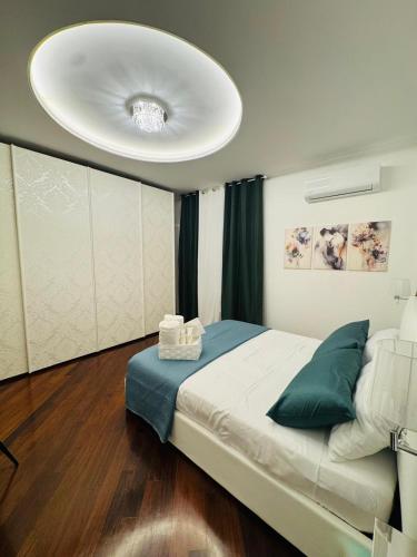 a bedroom with a large bed with a large ceiling at B&B Amo' in Forlì