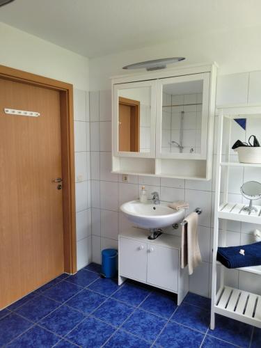 a bathroom with a sink and a mirror at Ferienwohnung Seewind in Überlingen
