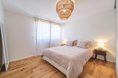Ένα ή περισσότερα κρεβάτια σε δωμάτιο στο Duplex Jardin – Gîte des 4 Lions