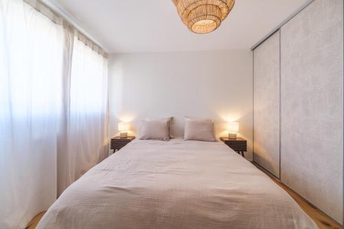 Ένα ή περισσότερα κρεβάτια σε δωμάτιο στο Duplex Jardin – Gîte des 4 Lions