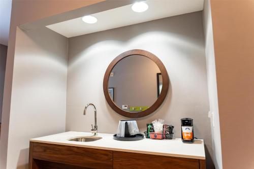 a bathroom with a sink and a mirror at Hampton Inn Turnersville in Blackwood