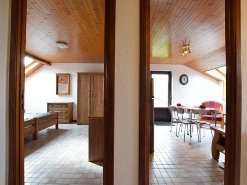 a kitchen and dining room with a table and chairs at Apartment in Champlon Ardenne in Champlon