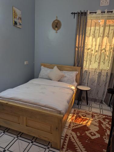 Ένα ή περισσότερα κρεβάτια σε δωμάτιο στο Utulivu Home Stay Apartment
