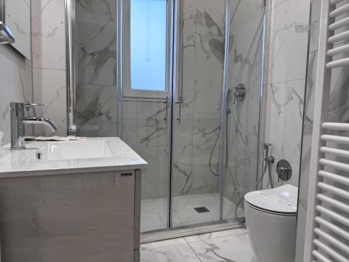 a bathroom with a shower and a sink and a toilet at a casa di Luca in Florence