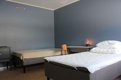 Postel nebo postele na pokoji v ubytování STF Luleå Gammelstad Hostel