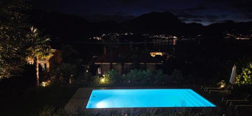a swimming pool in a yard at night at Hidden Gem - Villa with private swimmingpool Bellagio view in Lierna