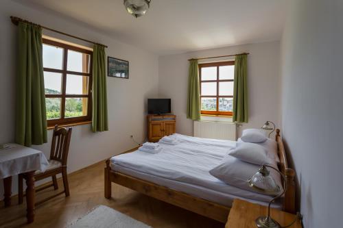 מיטה או מיטות בחדר ב-Figula Vendégház