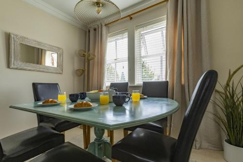 a dining room with a table with food on it at Castle Mill View in Oxford