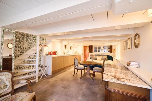 a kitchen and living room with a table and chairs at Van Gogh Studio in Amsterdam