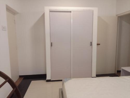 a white closet in a room with a bed at Villa28 Habaraduwa in Habaraduwa