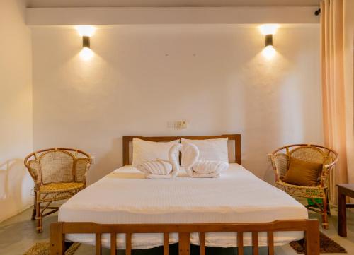 Postel nebo postele na pokoji v ubytování Prana Hotel Ahangama