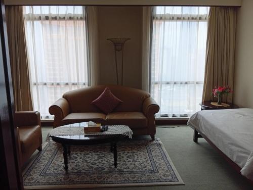 a living room with a couch and a coffee table at Fantastic appartment at times square Kuala Lumpur in Kuala Lumpur