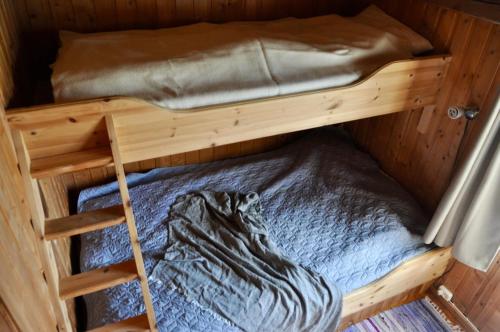 Postel nebo postele na pokoji v ubytování Flaksjøen