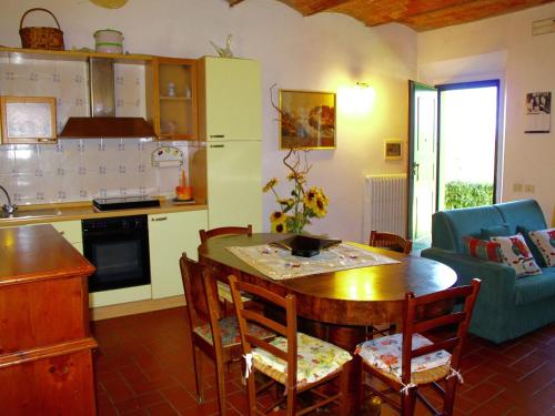 a kitchen and living room with a table and chairs at Rustic Farmhouse Living Vinci s Treasures in Vinci