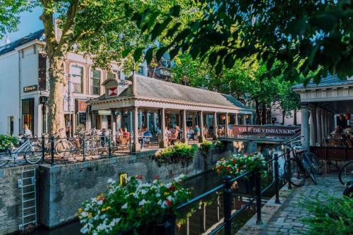 a building with a gazebo on a street at Gouda city center apartment with private garden and 2 bicycles in Gouda