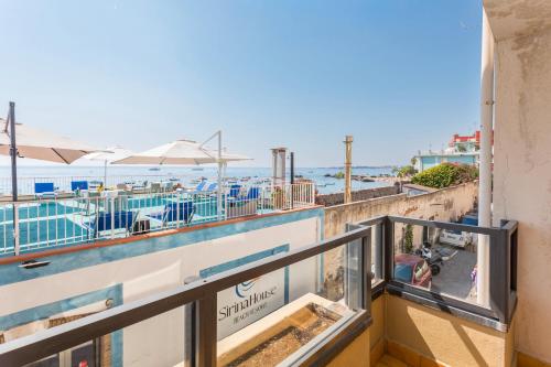 a balcony with a view of the ocean at Sirina Tao Beach in Taormina