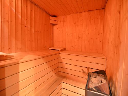 an empty wooden sauna with twothirds of the room at Panoramic Retreat in Malmedy in Malmedy