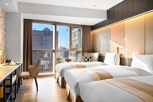 Katil atau katil-katil dalam bilik di Park Taipei Hotel