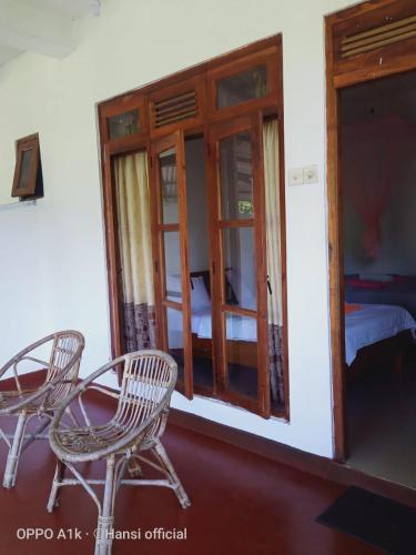 Ένα ή περισσότερα κρεβάτια σε δωμάτιο στο Nature's Glow Homestay And Resturant