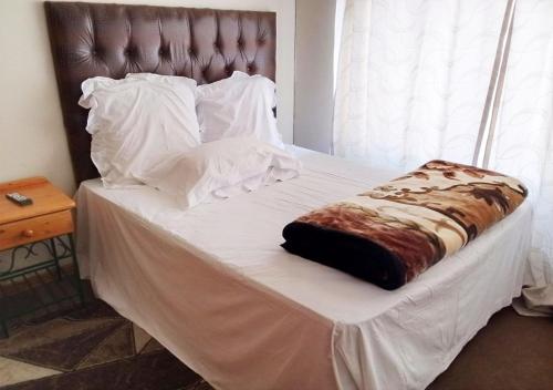 Cama o camas de una habitación en Nsk Guest House Alberton
