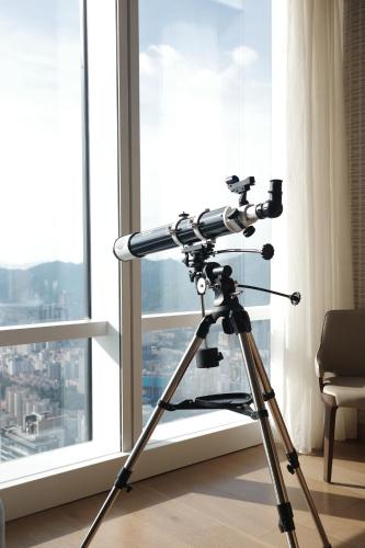 a camera on a tripod in front of a window at Mandarin Oriental, Shenzhen in Shenzhen