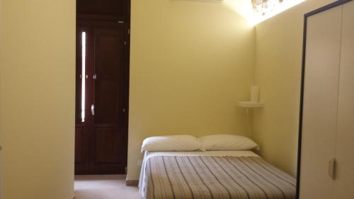 Ένα ή περισσότερα κρεβάτια σε δωμάτιο στο Beda Ragusa