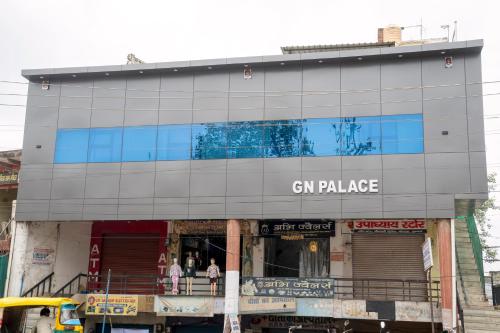 a building with a sign that reads gin palace at Hotel G N Palace in Agra