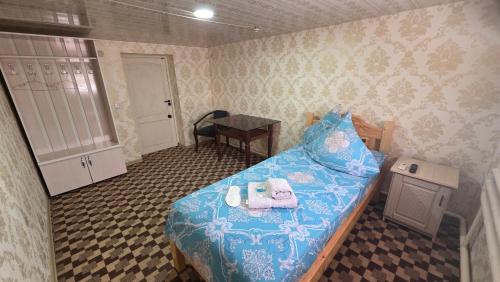 Ένα ή περισσότερα κρεβάτια σε δωμάτιο στο Guest House Dilorom B&B
