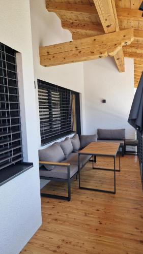 a living room with a couch and a table at Ferienwohnung Bergzauber in Maurach