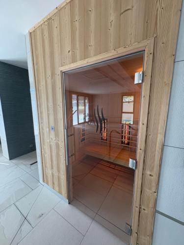 an open door into a room with a table at DOMITYS - La Florentine in Sarreguemines