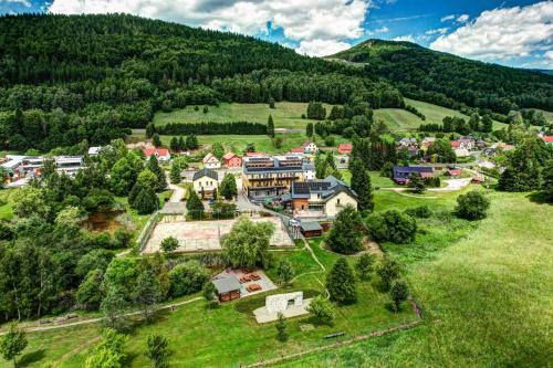 an aerial view of a town in the mountains at Hotel Helios in Lipova Lazne
