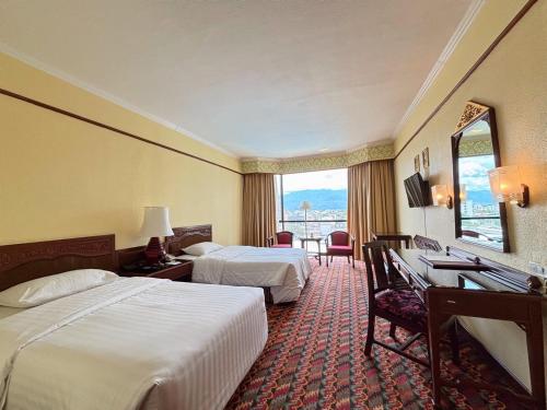 Ένα ή περισσότερα κρεβάτια σε δωμάτιο στο The Empress Hotel